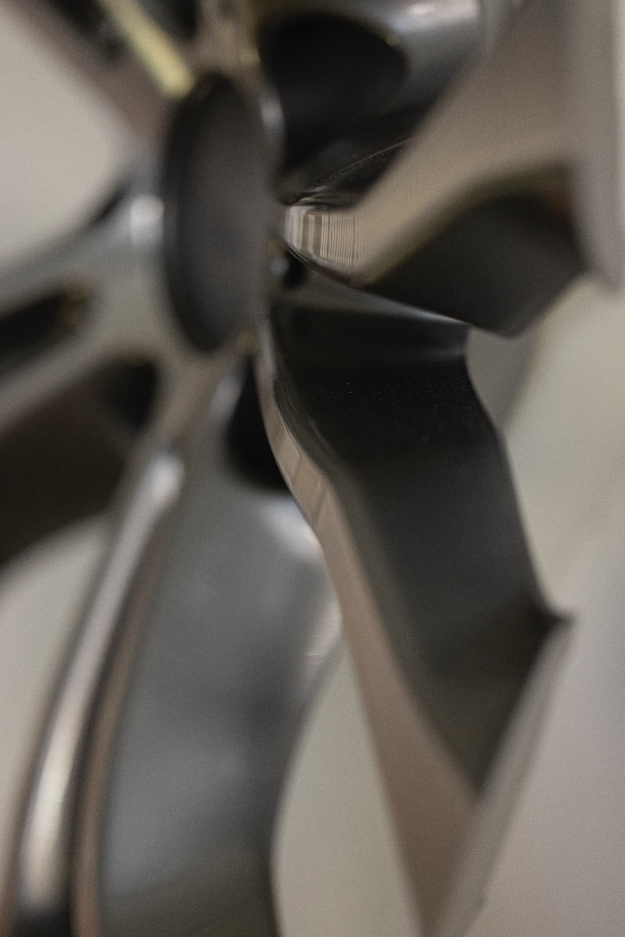 Abstract close-up of a polished metallic surface with soft reflections